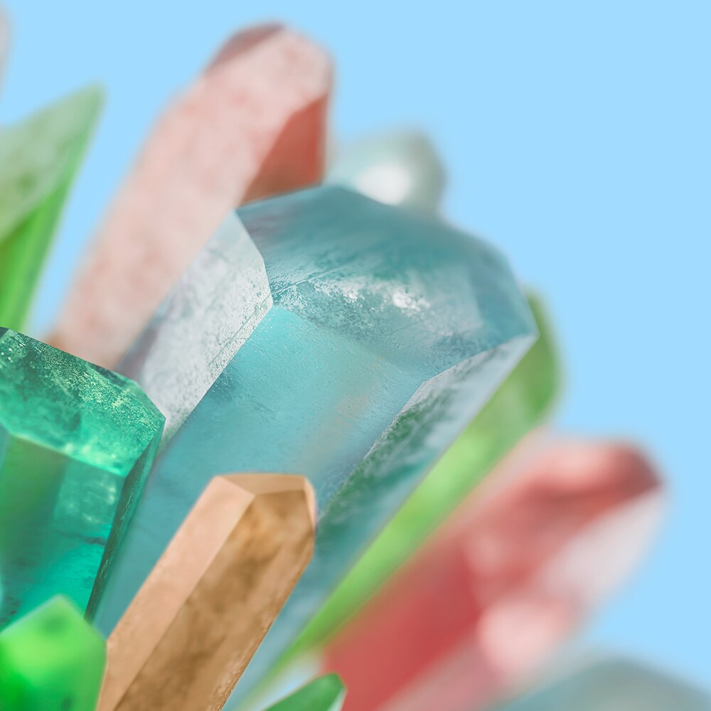 colorful crystals on teal background