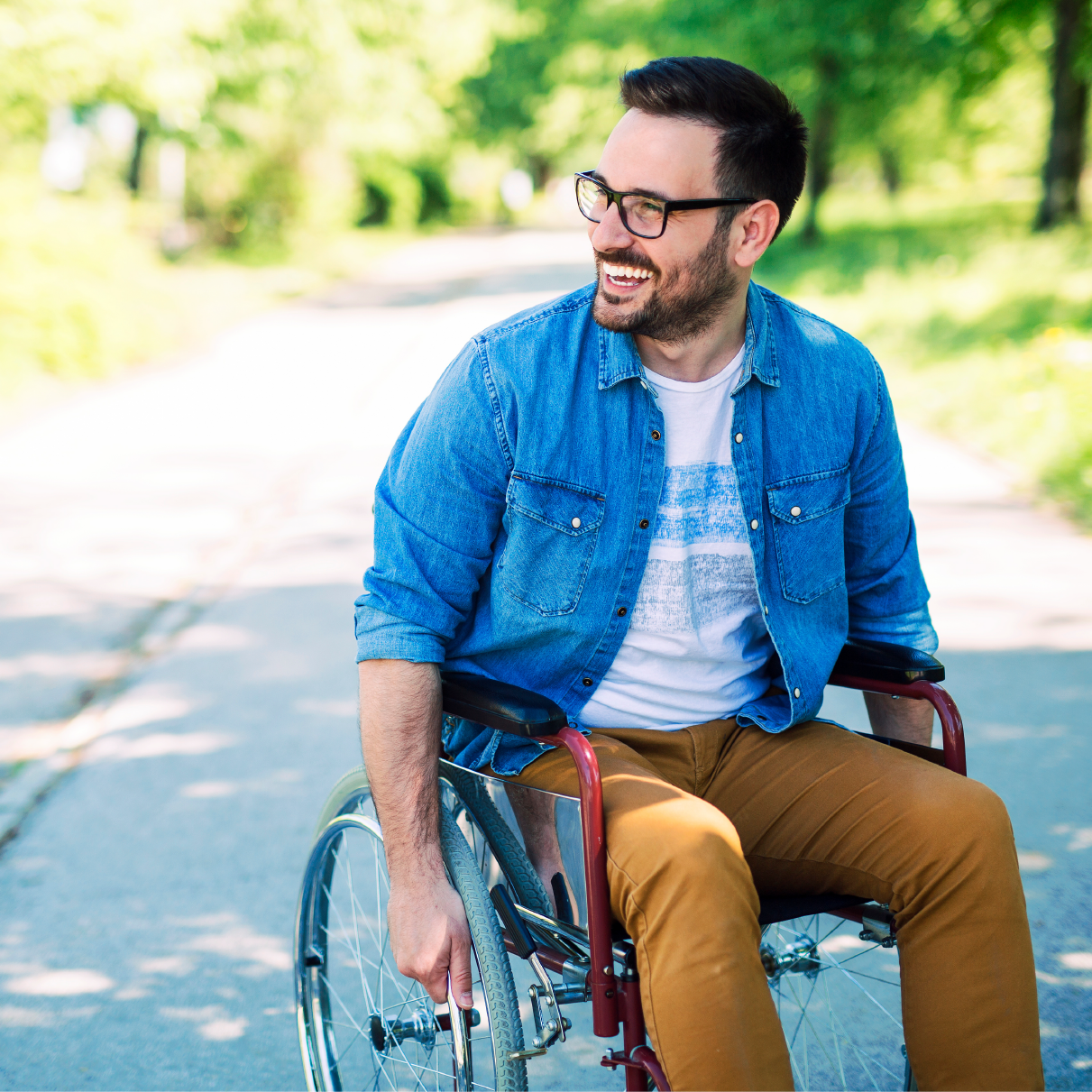 smiling man in wheelchair square