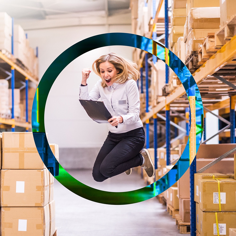 Woman jumping in warehouse in graphic circle
